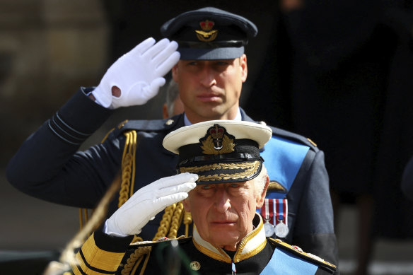 King Charles III and Prince William salute during the state funeral of Queen Elizabeth II.