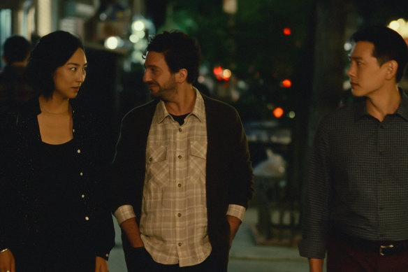 Greta Lee with John Magaro and Teo Yoo.