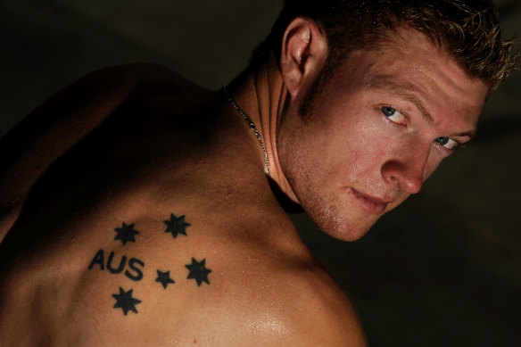 Joel Milburn showing his Southern Cross tattoo, which he got when he was 17.