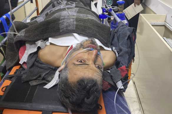 Samir Muhammed Accar after he was pulled out from a collapsed building.