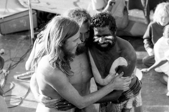 A group embrace after an Indigenous dance performance by the Mornington Island group.