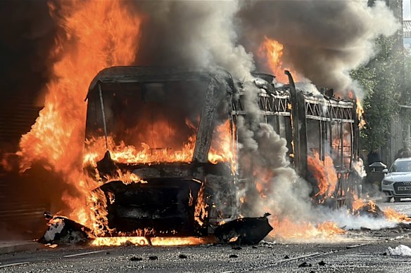 A bus set on fire by protesters in east Belfast.
