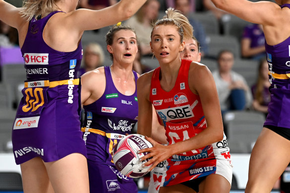 Swamped: Swifts attack Helen Housby surrounded by the Firebirds defence.