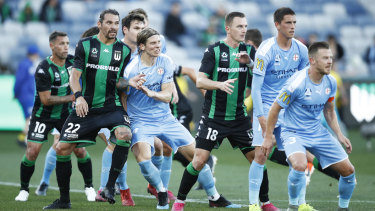 Push and shove: Players pack the penalty box in preparation for a corner during the clash at GMHBA Stadium in Geelong.