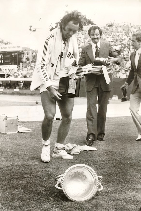 The trophy juggle becomes too much for the victorious Edmondson.