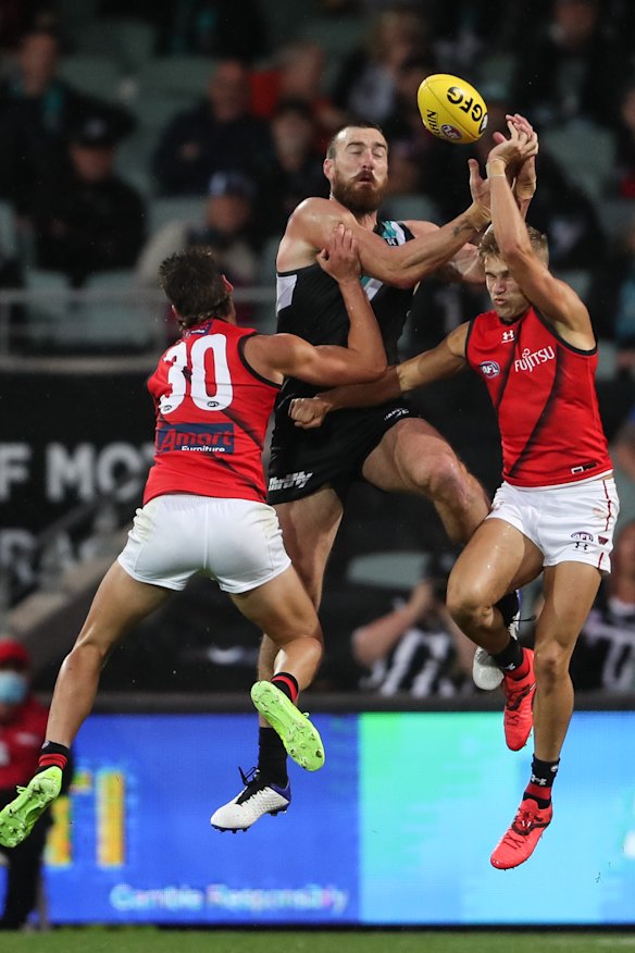 Charlie Dixon attempts to mark. 