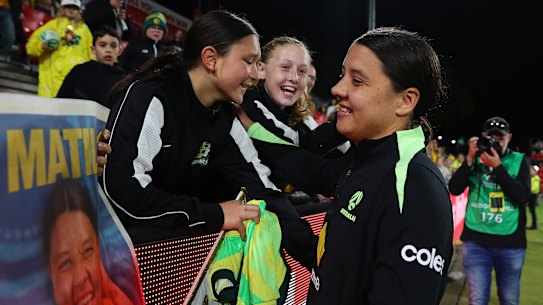 Sam Kerr interacts with Matildas fans after the 2-0 win over New Zealand in Adelaide.