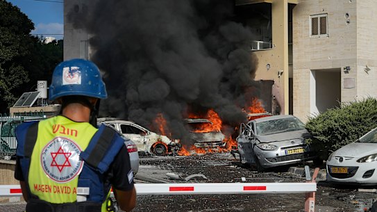 Cars burn after a rocket fired from the Gaza Strip hit a car park and residential building in Ashkelon, southern Israel, at the weekend.