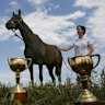Makybe Diva, with her Cups and strapper Christine Mitchell at trainer Lee Freedman's Rye property in 2005.