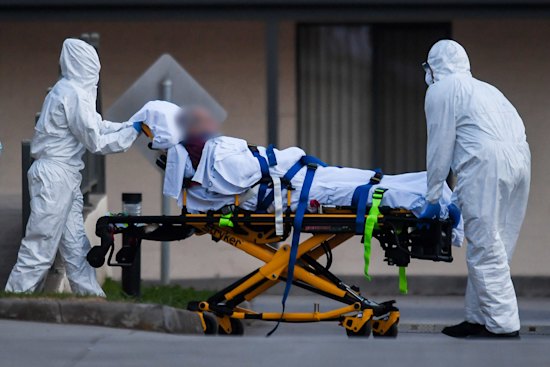 A St Basil’s resident is evacuated from the home in July 2020.