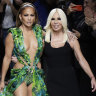Actress Jennifer Lopez and designer Donatella Versace recreate the singer’s red carpet Grammy moment on the Milan runway in 2019.