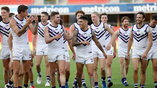 Michael Walters and the Dockers celebrate their first win of the season.