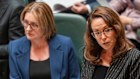 Treasurer Jaclyn Symes delivering her budget speech in parliament next to Premier Jacinta Allan, is now in New York talking to rating agencies.