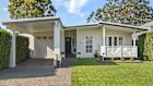 The four-bedroom house on 689 square metres at 17 St Johns Drive in the NSW Lake Macquarie suburb of Croudace Bay sold after auction for $1.88 million.