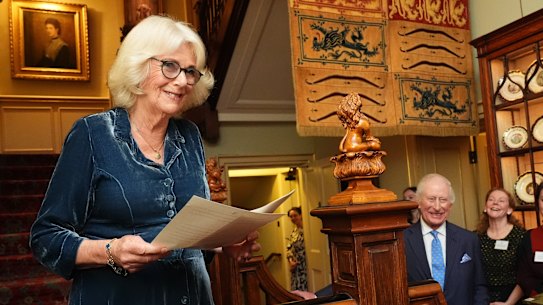 Queen Camilla speaks as King Charles looks on during a reception to mark the launch of the Queen’s reading room medal at Clarence House on Tuesday.