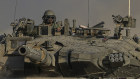 An Israeli soldier driving a tank near the Israeli-Gaza border.