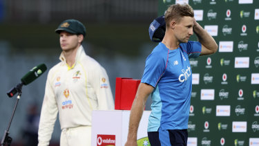 Joe Root (right) walks off the podium as Steve Smith accepts the plaudits after Australia went 2-0 up in the Ashes in Adelaide.