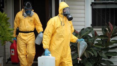 A file picture of drug squad officers removing ice-making equipment and chemicals from an illicit ice-making lab in Melbourne's west.