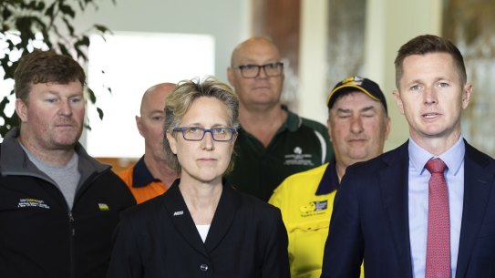Dan Walton in Parliament House on Tuesday, flanked by ACTU secretary Sally McManus and union members, calling for government to cap coal prices.