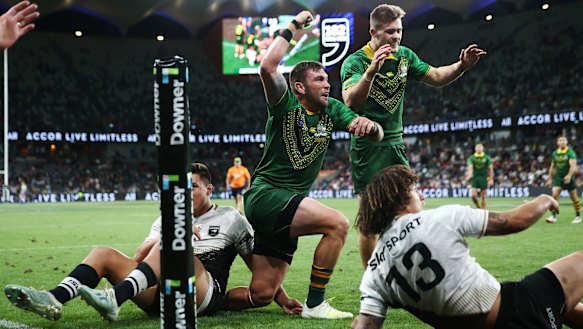 Kyle Feldt of Australia celebrates scoring a try in the men's final against New Zealand at Bankwest Stadium.