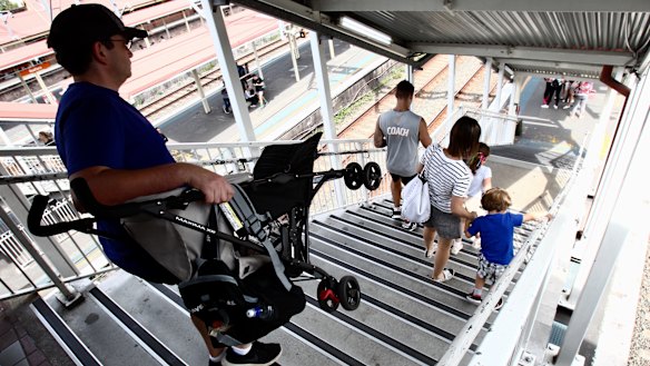 Parents forced to carry prams down the stairs at Redfern station. 