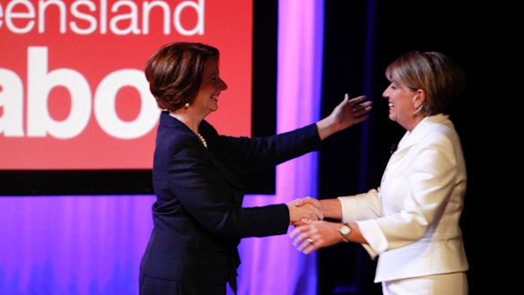 Then-prime minister Julia Gillard greets Queensland premier Anna Bligh at the 2012 campaign launch.