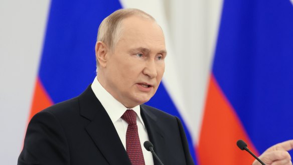Russian President Vladimir Putin gestures during a ceremony to sign the treaties for four regions of Ukraine to join Russia.