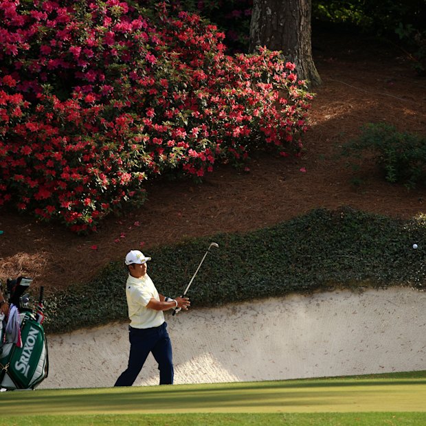 Hideki Matsuyama plays a shot from the bunker at the 12th hole at Augusta National.