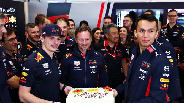 Red Bull Racing Team principal Christian Horner is presented with a birthday cake by Verstappen and Alexander Albon of Thailand.