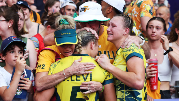 Teagan and Maddison Levi are comforted after the women’s sevens side’s loss in the bronze-medal match.