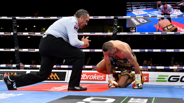 Down and out: Anthony Mundine is counted out after being felled by a left hook at Suncorp Stadium. 