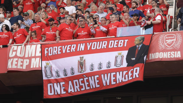 Arsenal fans pay tribute to departing manager Arsene Wenger.