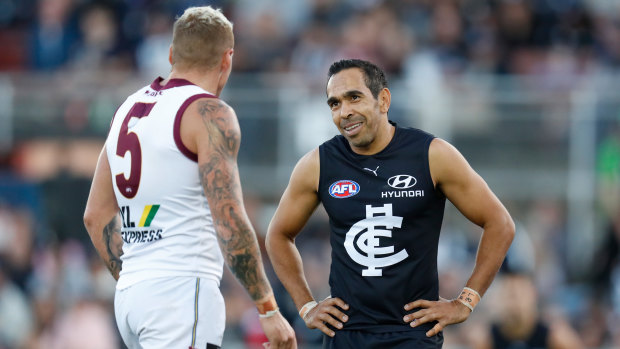 Good cheer: Mitch Robinson of the Lions and Eddie Betts of the Blues share a laugh during the Marsh Community Series match between Carlton and Brisbane at Ikon Park in Melbourne.