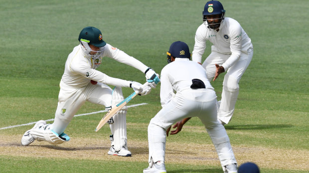Close call: Peter Handscomb edges a ball onto his thigh during day four.