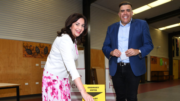 The premier casts her vote on election day with federal member for Oxley Milton Dick.
