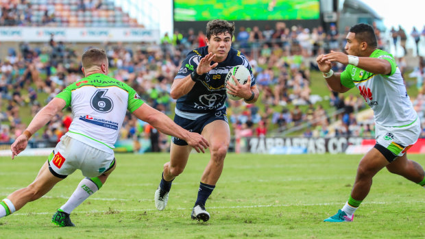 Jake Clifford of the Cowboys looks for a gap in the Raiders defence at 1300SMILES Stadium in Townsville on Saturday. Clifford and his halves partner, captain Michael Morgan, made three errors each in their loss. 