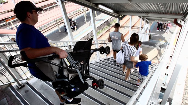 Parents forced to carry prams down the stairs at Redfern station. 