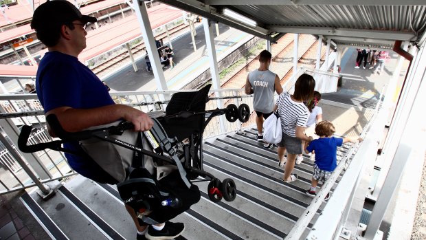 Parents forced to carry prams down the stairs at Redfern station. 