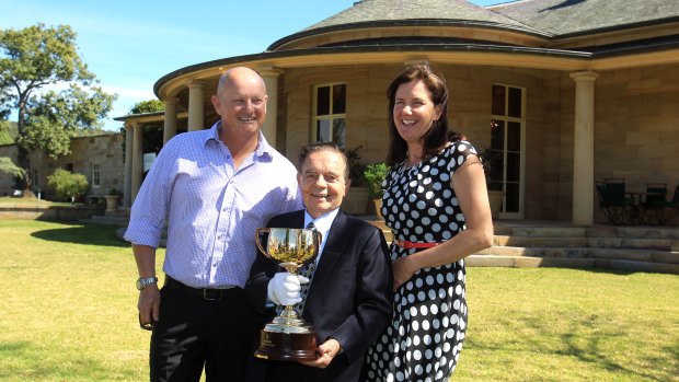 Simon and Brenda Tripp with Melbourne Cup-winning jockey Ray Selkrig in 2013.