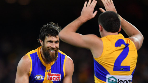 West Coast's Josh Kennedy and Jake Waterman celebrate a goal during the match against the Crows in Adelaide.
