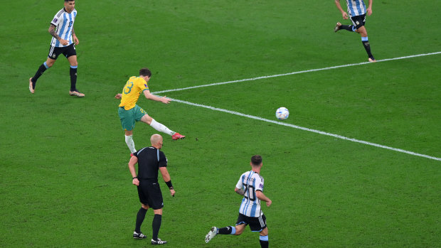 Craig Goodwin’s smash deflects from an Argentine defender and becomes an own goal..