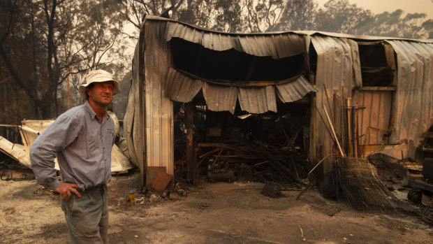 Rob Meggs inspects his shed after the Wrights Creek fire swept through the outskirts of Kulnura, west of the Central Coast. 
