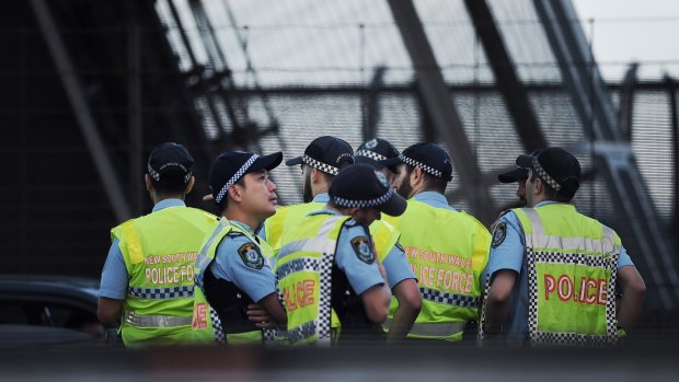 Police stand on the Sydney Harbour Bridge during a police operation on Wednesday morning.