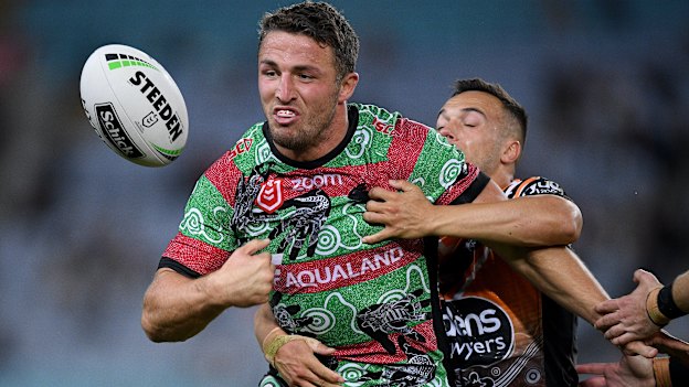 Luke Brooks applies pressure to Souths hardman Sam Burgess.