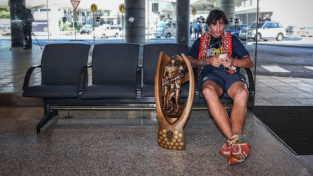 Just me and my little mates … Johnathan Thurston with the Provan/Summons trophy after winning the grand final in 2015.