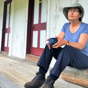 Jennifer Horsfield enjoys a cuppa on the veranda of historic Orroral Homestead.