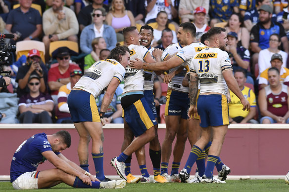 Parramatta celebrate the Jakob Arthur try which all-but killed off any hopes of a Warriors comeback at Suncorp.