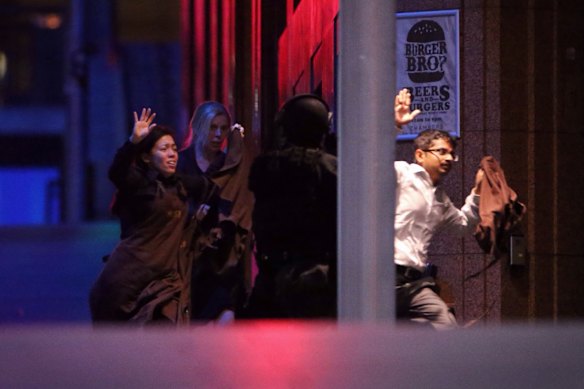 Hostages flee the Lindt Cafe siege on in December 2014. 