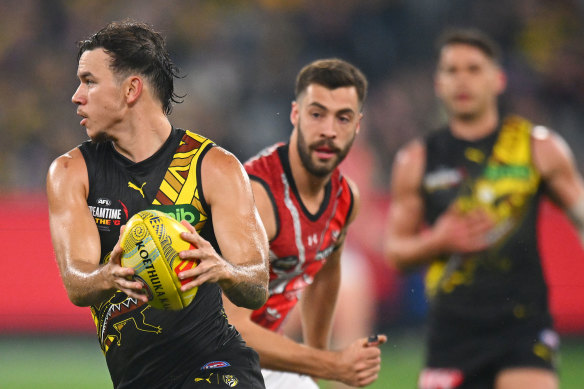 Daniel Rioli of the Tigers takes possession of the ball.