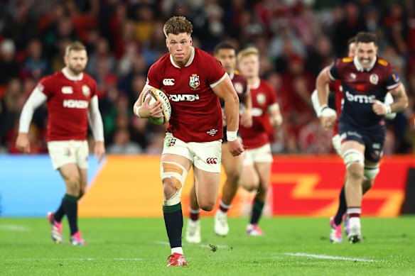 Huw Jones of the British & Irish Lions makes a break in Brisbane